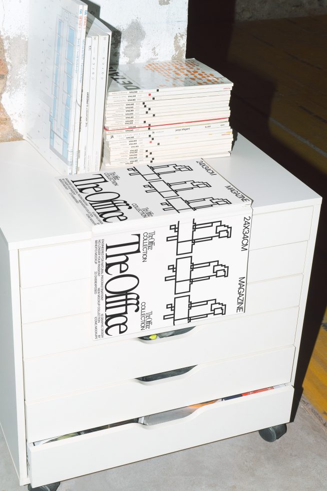 Modern graphic design magazine mockup on white cabinet, showcasing typography, layout, editorial design for digital asset marketplace.