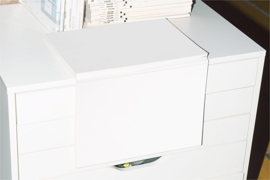 White desk drawers with blank surface for design placement in office