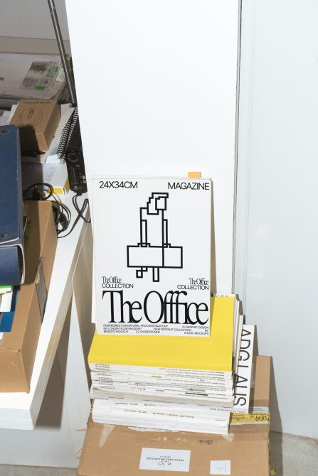 Stack of magazine mockups with modern graphic design, titled The Office Collection on display for creative professionals and designers.