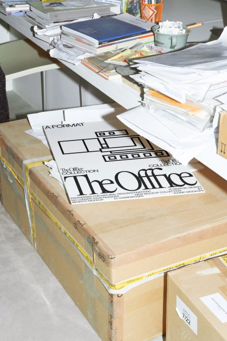 The Office box mockup opened showing poster design with line art