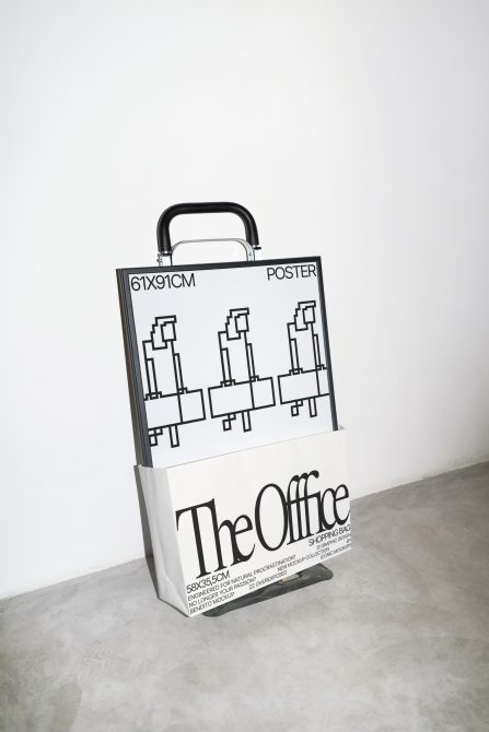 The Office shopping bag mockup with black handle standing upright