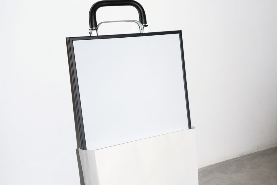 Blank poster mockup with black handle on neutral background