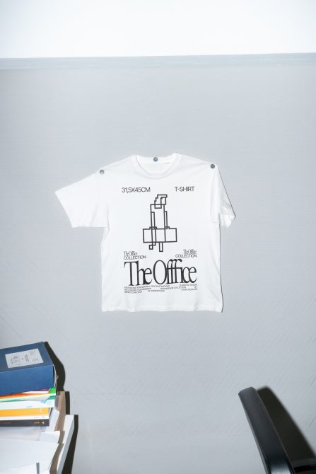 Oversized white t-shirt mockup shot from neutral angle overhead