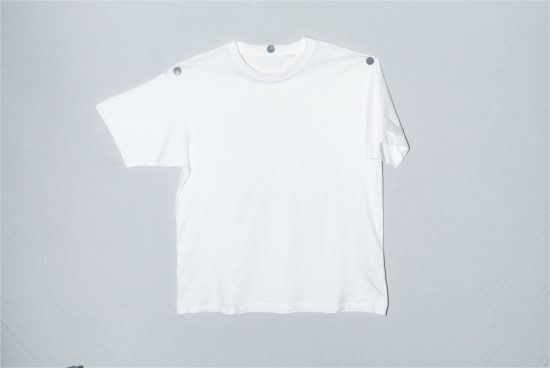 Plain white t-shirt mockup on a grey background, ideal for presenting apparel design and branding for designers.