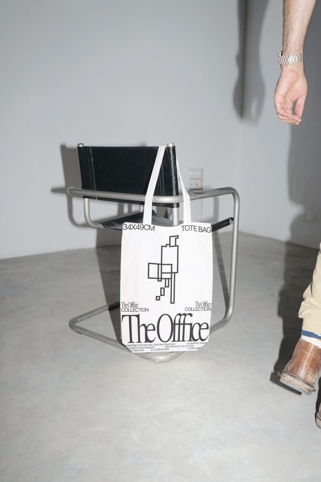 Modern tote bag mockup on chair in a minimalist setting, ideal for showcasing design work, branding, and product presentation.