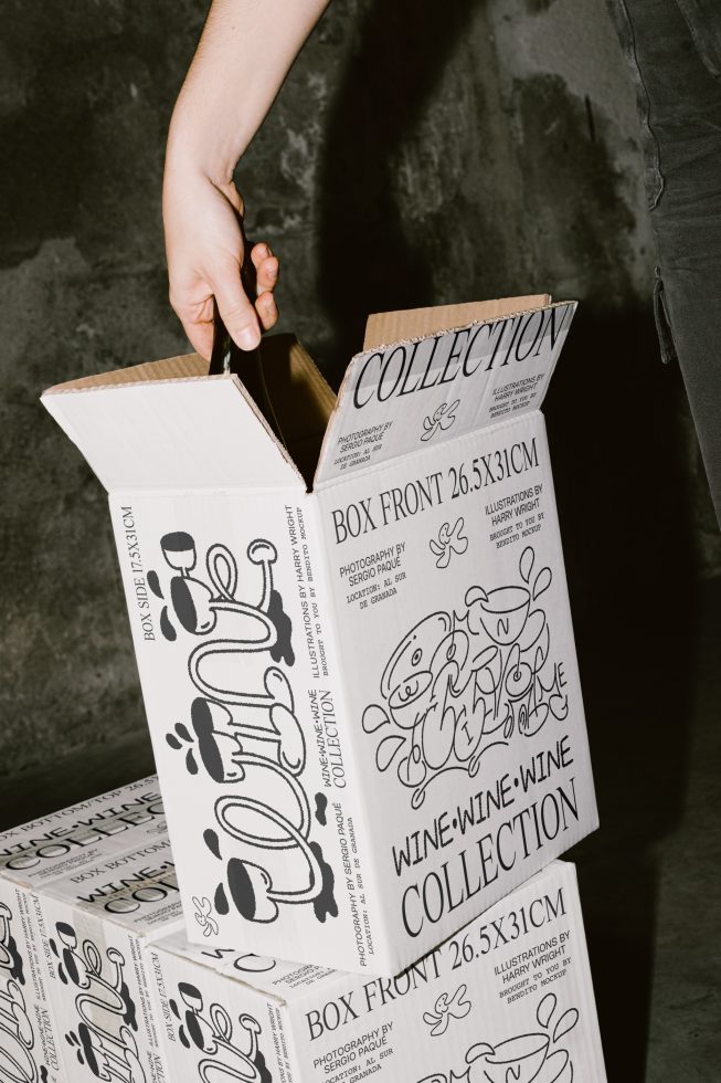 Person opening a box with creative black and white typography design, perfect for mockup graphics display in packaging design presentations.