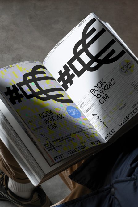 Open book mockup with bold black logo, colorful gradient pages, grid layout text