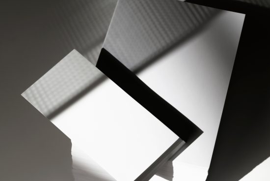 Abstract monochrome paper mockup with shadows, perfect for modern graphic design presentations, minimalistic templates.