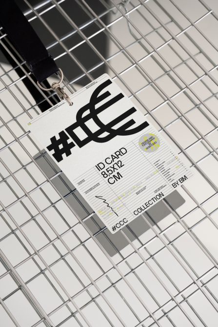 ID card 85x12cm mockup hanging on wire grid with black lanyard clip