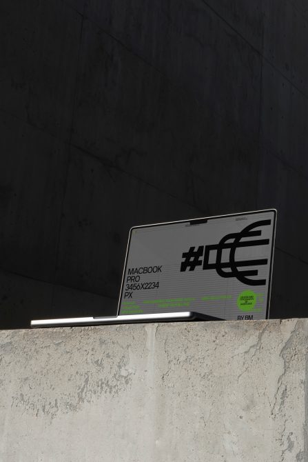 MacBook Pro screen mockup on concrete ledge against dark background