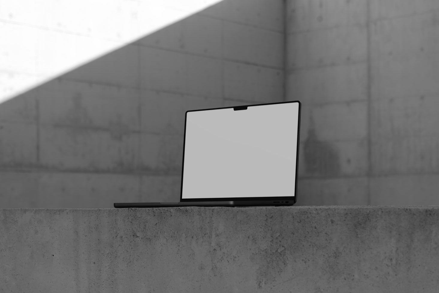 Laptop mockup with blank screen on concrete bench in sunlight for graphic design templates display, minimalistic modern style.