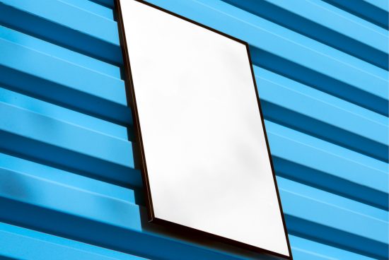Blank billboard mockup on blue corrugated metal wall for graphic designers to display advertising designs.