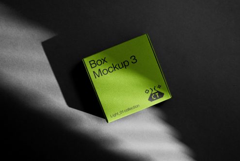 Bright lime cube box mockup with angled light beam on dark gray background