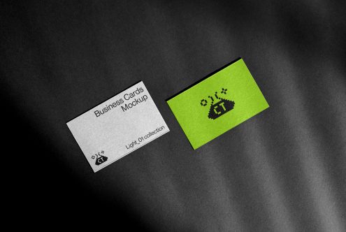 White business card beside neon green card with pixel logo on dark background