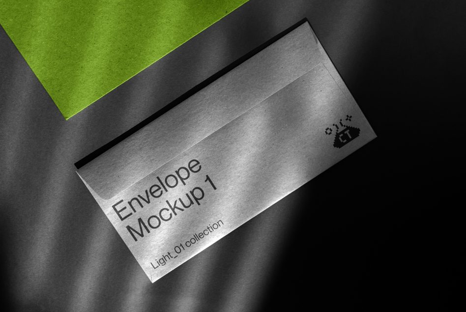 Silver envelope mockup on dark surface with lime accent