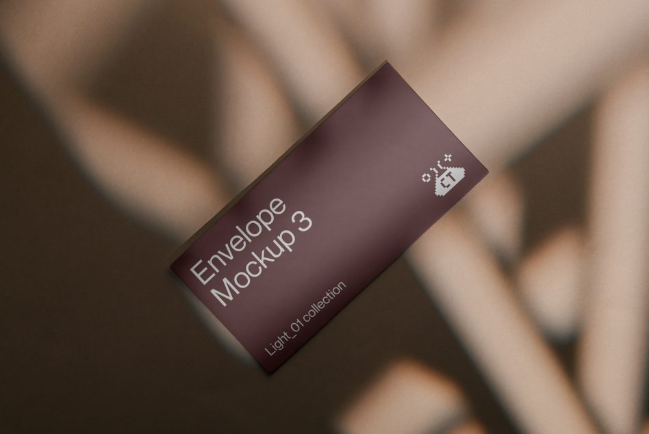 Burgundy envelope mockup tilted on soft blurred background
