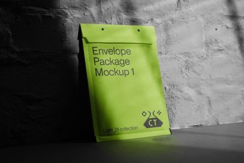 Lime green envelope package with flap design casting shadow on concrete