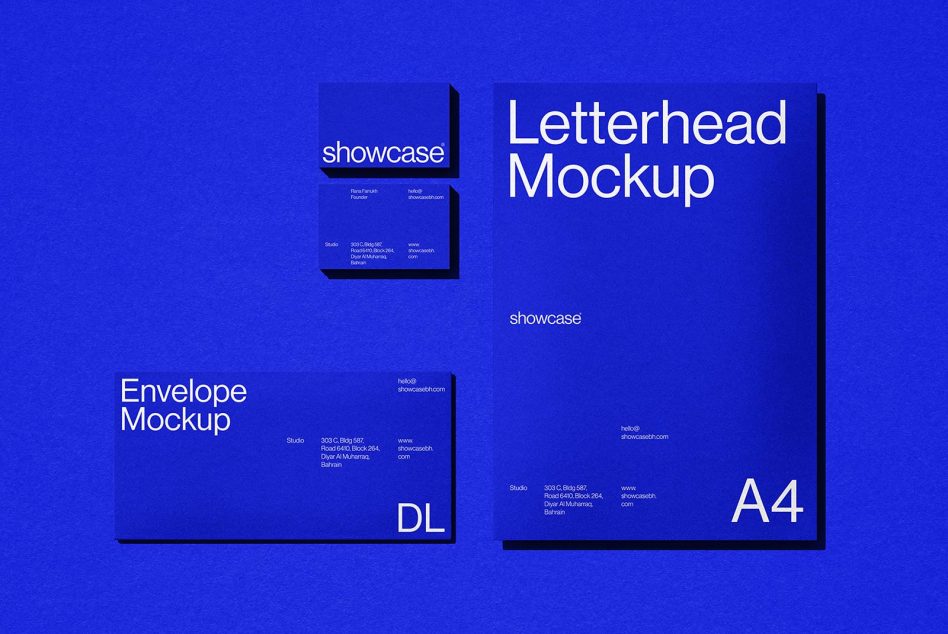 Blue letterhead, envelope, business card mockups displayed on bright blue background