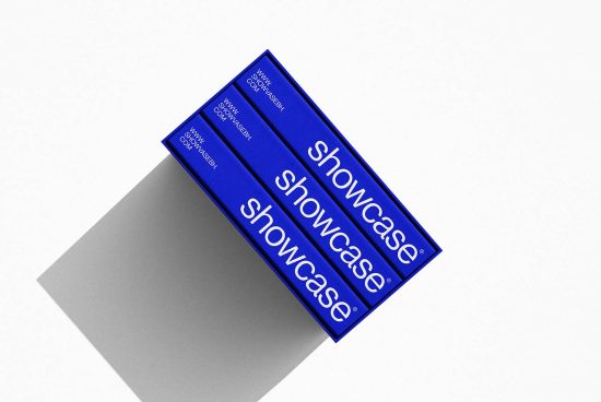 Three blue book mockups with the word showcase on the cover, stacked diagonally, presenting a clean design for branding.
