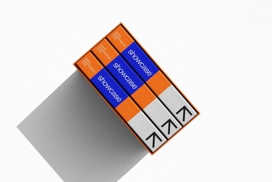 Orange and blue book mockup on white background with shadow, displaying spine design, perfect for presentation in design portfolios.