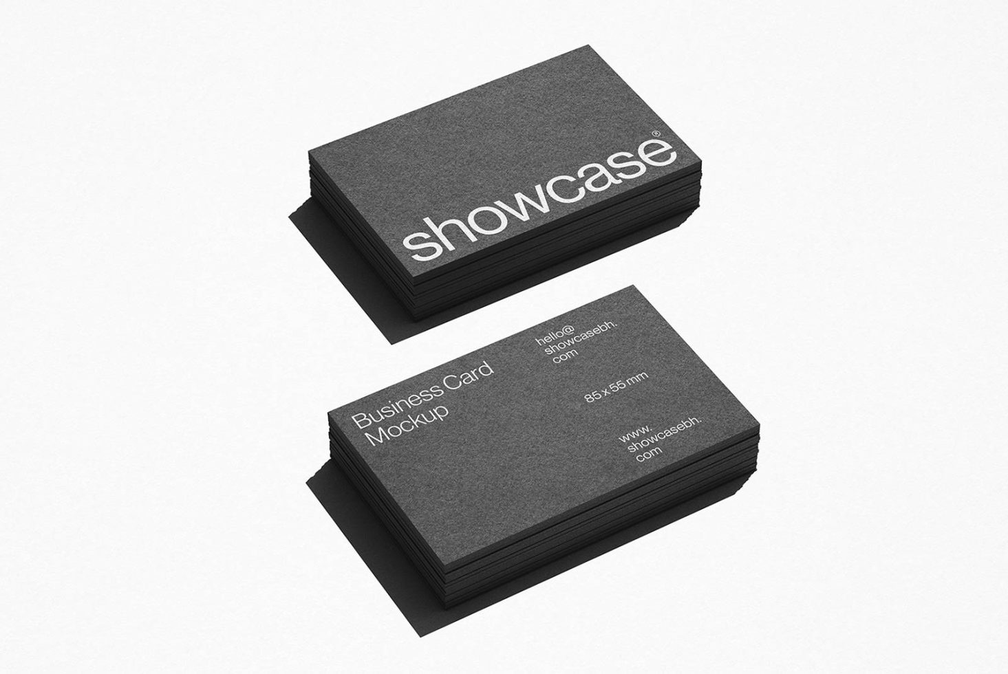 Stack of black business cards with white text for design mockup on a light background, showing front and back views for print design showcase.