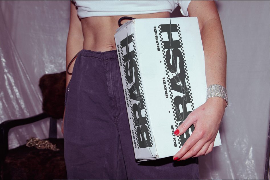 Off-white BRASH clutch with graphic logo on textured surface