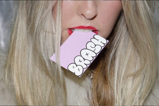 Close-up of woman with graphic card in mouth, trendy design, creative mockup, contemporary art, fashion, beauty concept.