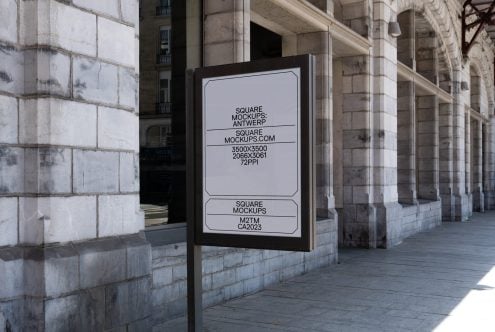 Street-mounted square sign mockup on weathered stone building facade with minimal branding text