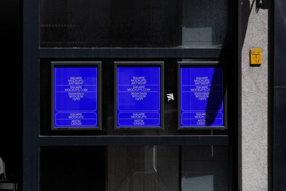 Bright blue neon square mockups glowing in dark storefront, three panels lit up