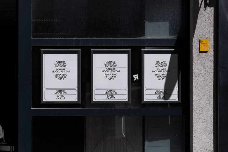 Three white square mockups in storefront window with black frame, harsh sunlight shadows