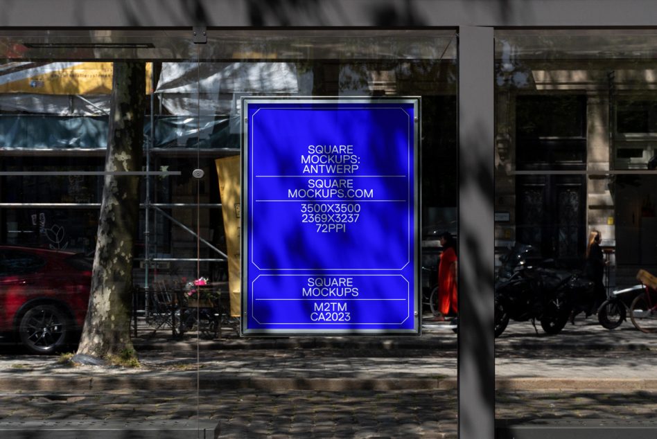 Street-level glass display with vivid blue neon text inside framed light box