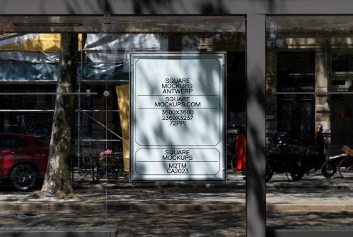 Glass storefront window with mounted light box showing clean minimal layout design