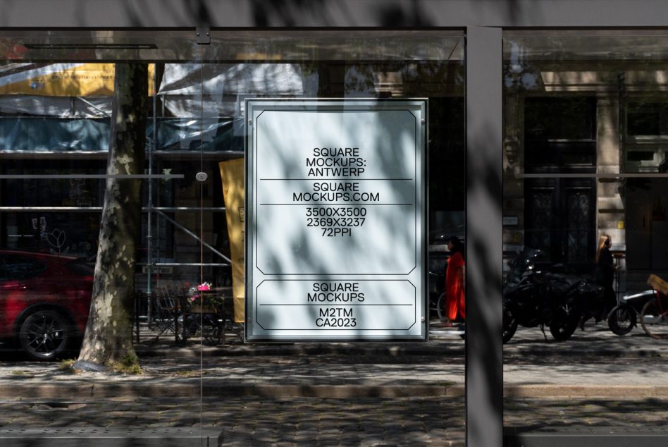 Glass storefront window with mounted light box showing clean minimal layout design