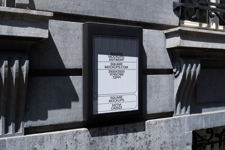 Stone building facade with mounted light box displaying simple white mockup design