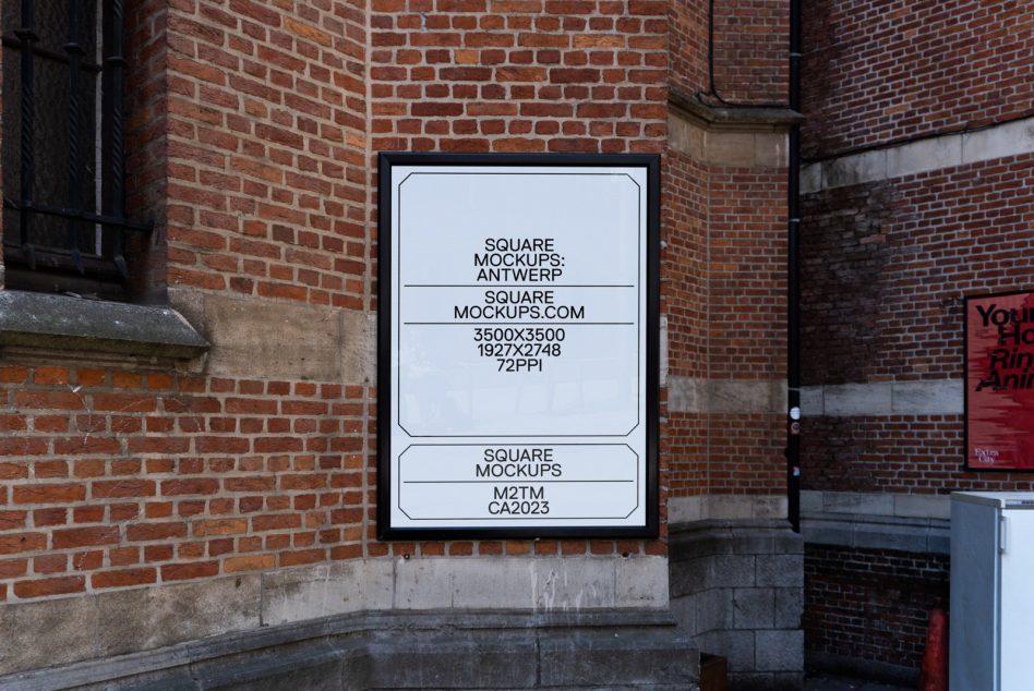 Light box mounted on red brick wall showing white background with black text layout