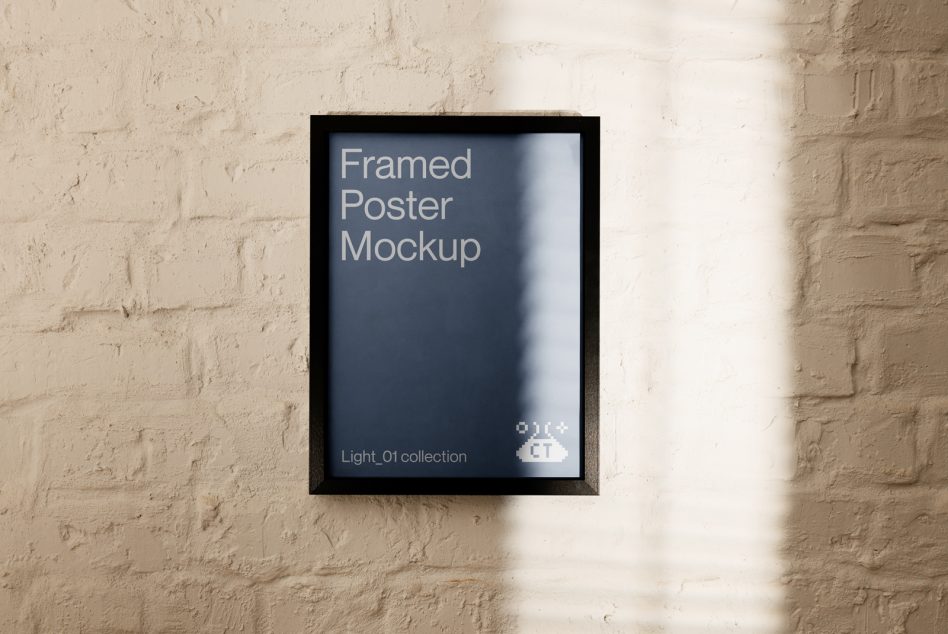 Black frame on cream brick wall containing mockup design with shadow overlay