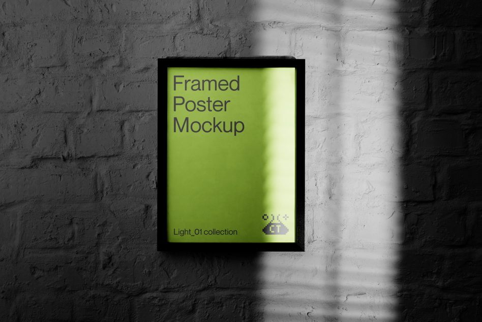 Black framed poster mockup with bright lime green interior on white brick