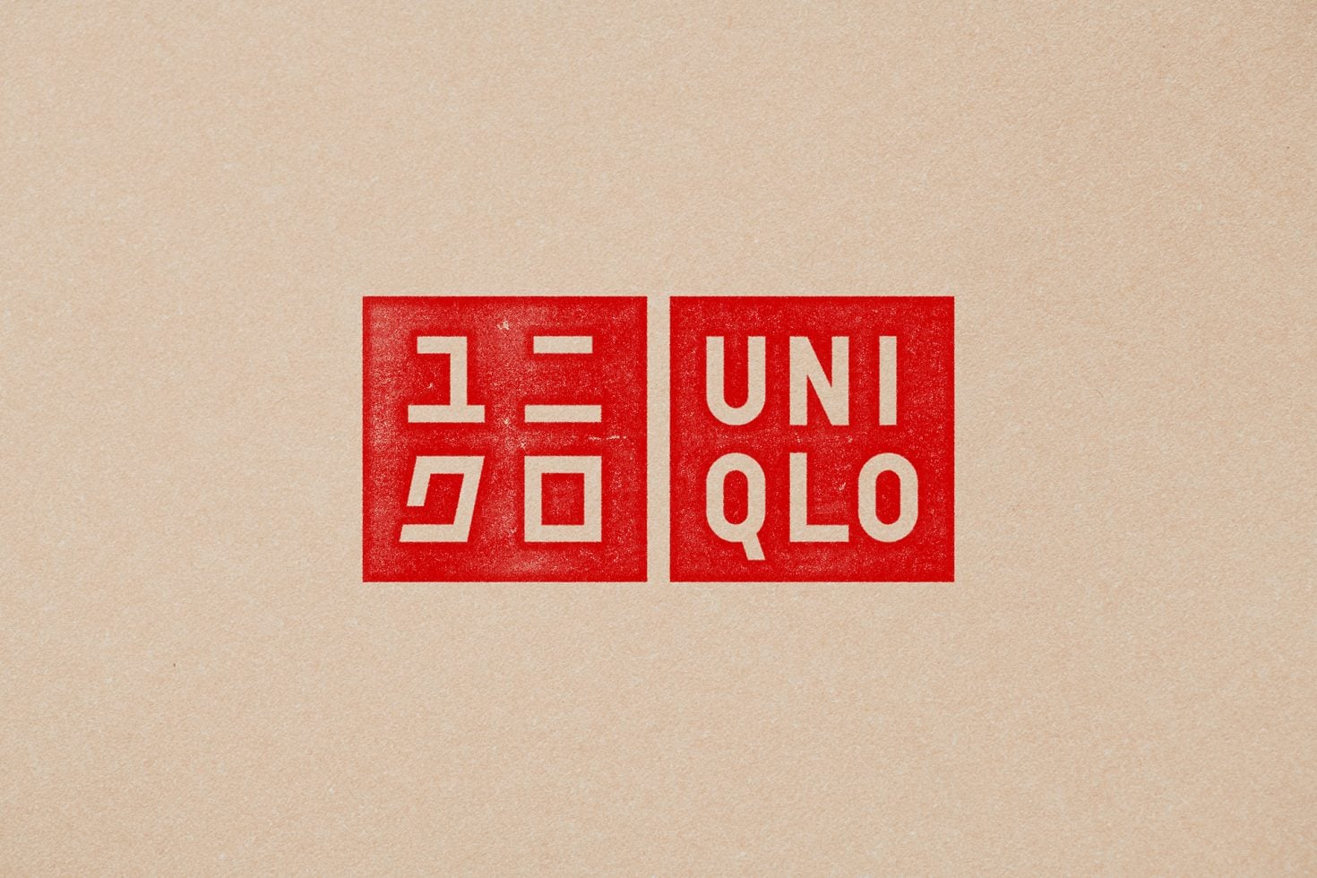 Red stamp mockup on kraft paper showing Uniqlo logo with textured grunge finish