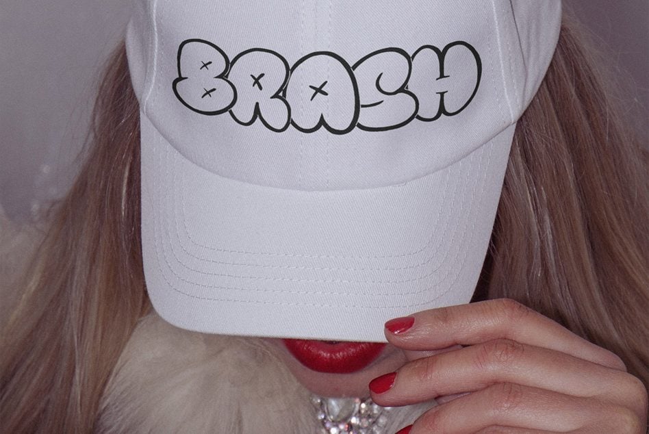 White cap with black outline bubble letter graffiti design