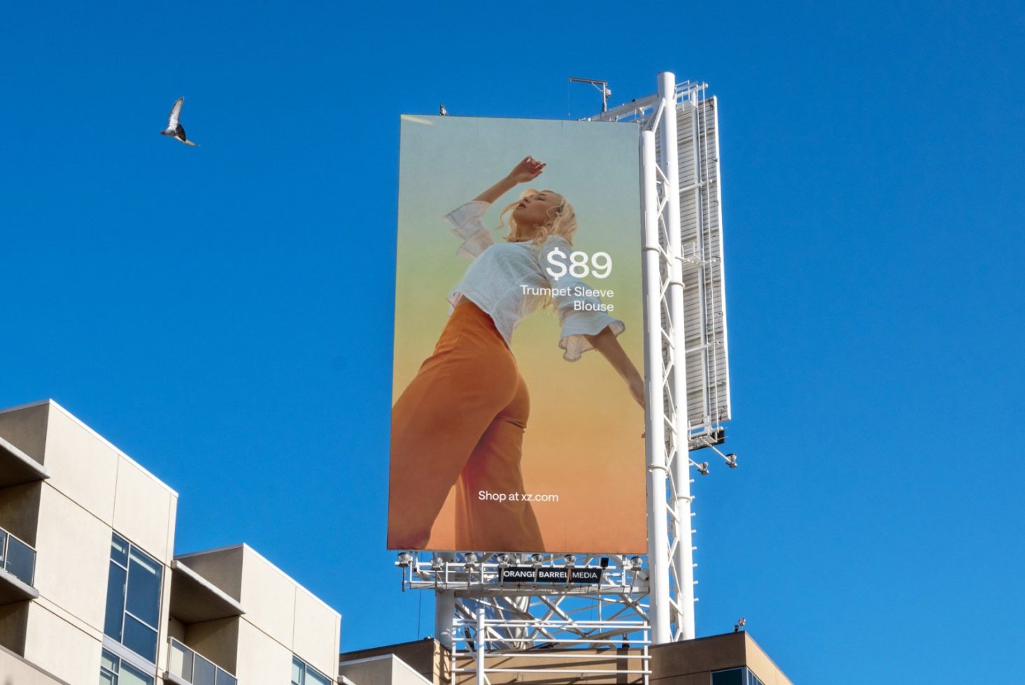 Billboard mockup on a clear day with a fashion ad featuring a woman, ideal for designers to showcase outdoor advertising graphics.