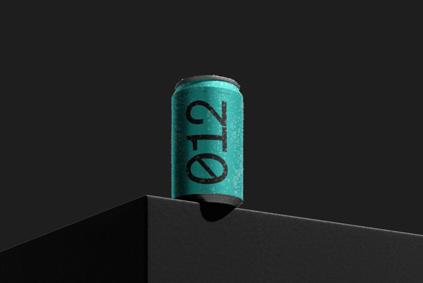 Teal soda can mockup with condensation on minimalist black shelf, ideal for beverage branding presentations and packaging design.