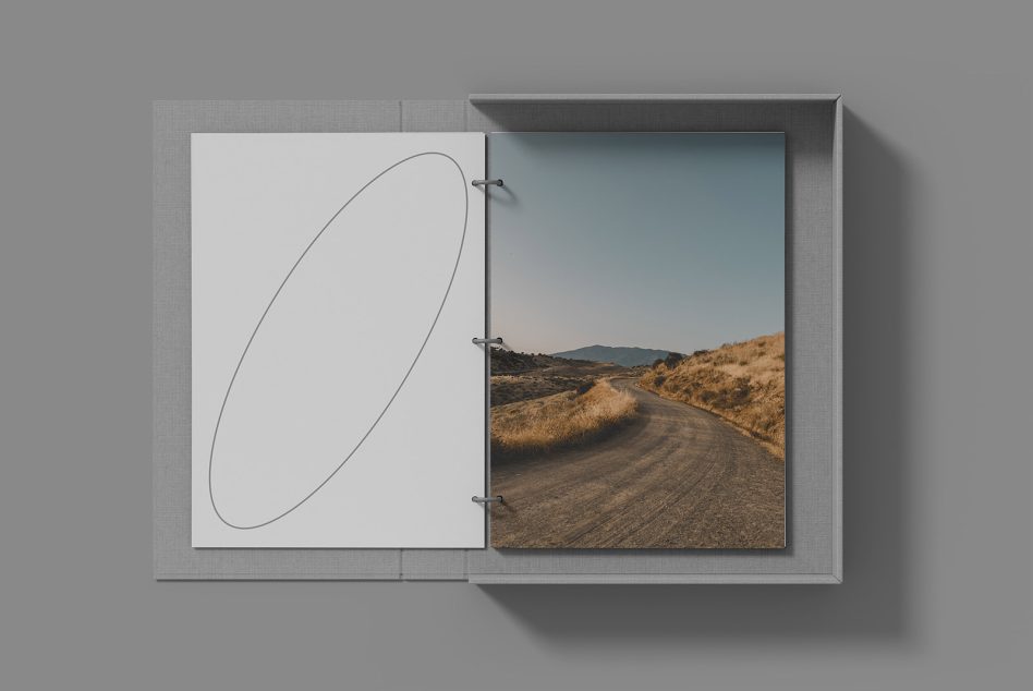 Elegant open photo album mockup with landscape image, showcasing design presentation, ideal for Mockups, Portfolio Display, Print Design.