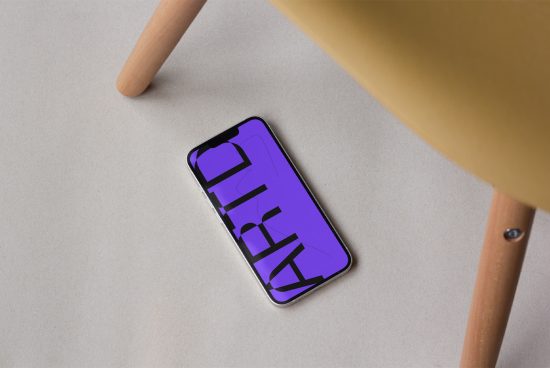 Smartphone mockup with violet screen on a beige surface, design presentation tool, digital assets, mobile display mockup for designers.