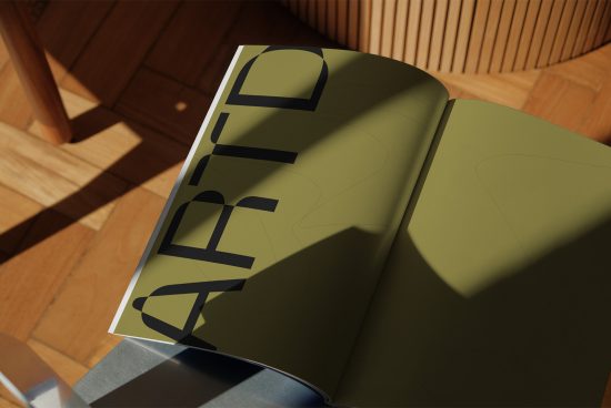 Open magazine mockup on wooden table with shadow overlay, showcasing bold font design, ideal for presentations, digital assets for designers.