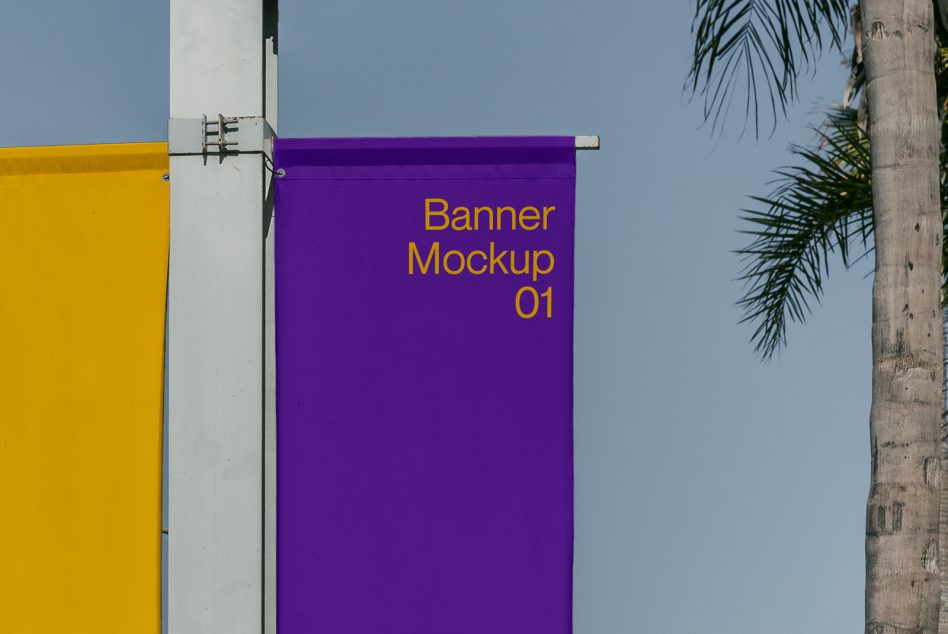 Purple hanging banner mockup with yellow text against clear sky with palm tree