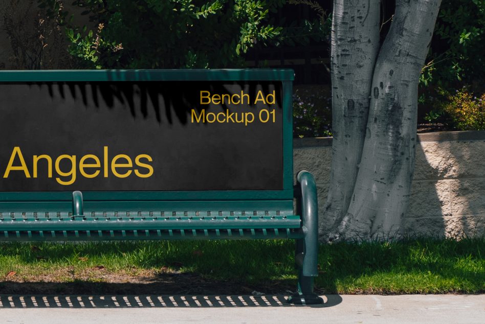 Teal park bench with black backrest displaying yellow text reading Angeles with shadow overlay