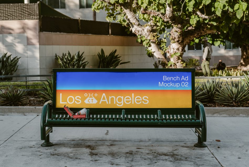 Green park bench with digital screen showing Los Angeles ad mockup in urban courtyard