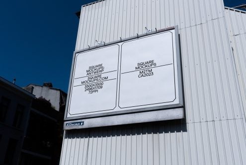 Clean white outdoor billboard mounted on metal building with rounded square mockup frames