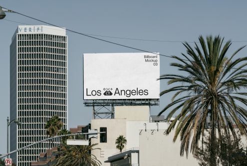 White billboard showing Los Angeles next to Verifi building with palm trees