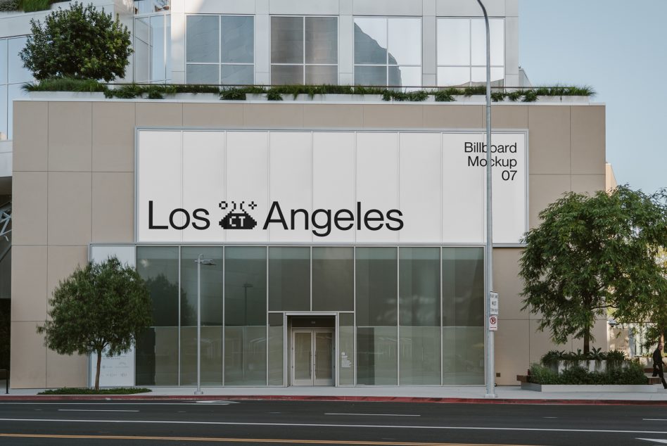 Modern building facade with white billboard displaying Los Angeles text mockup